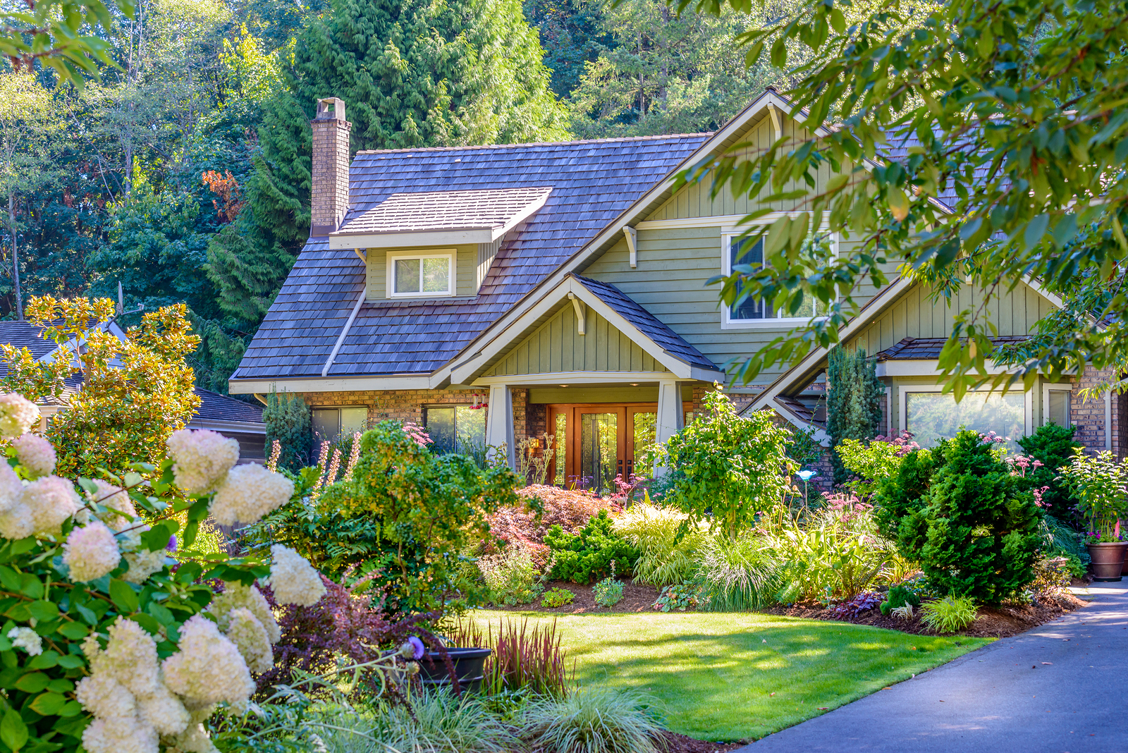 A perfect neighborhood. Houses in suburb at Fall in the north Am A perfect neighborhood. Houses in suburb at Fall in the north America. Fragment of a luxury house with nice window.